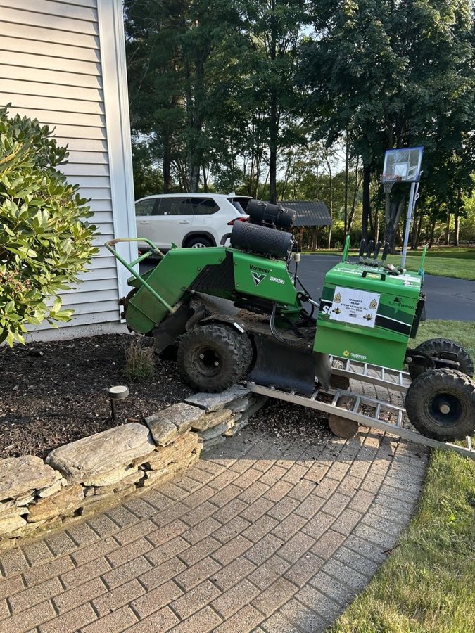 Sergeant Major Stump Grinding's stump grinder parked beside a home in Vernon, CT
